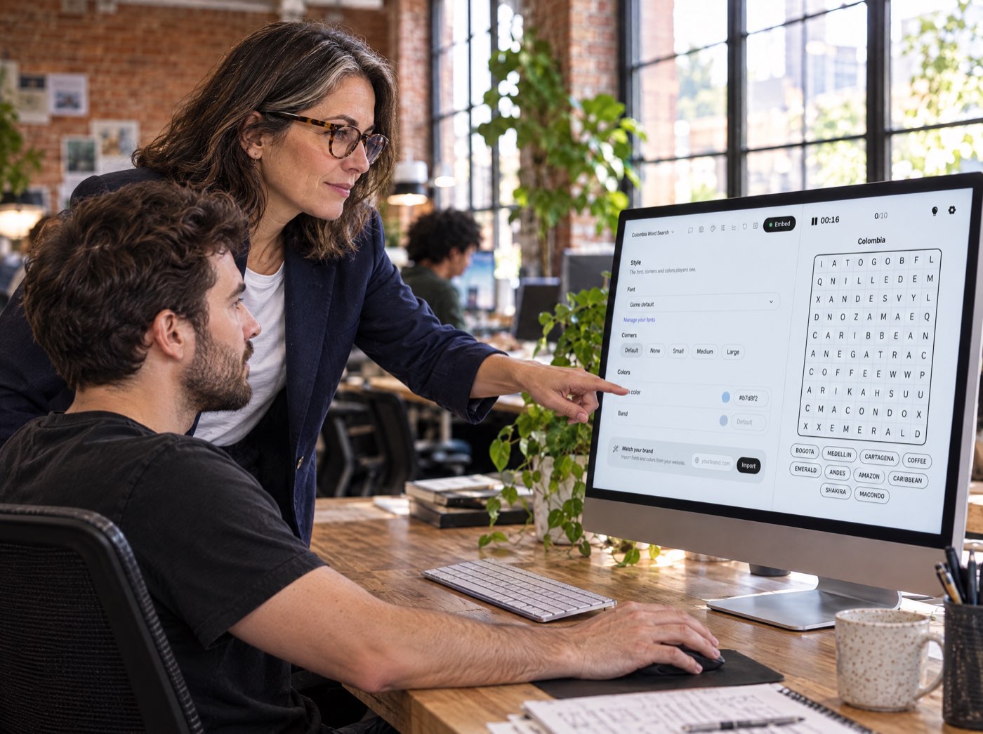 The editor-in-chief and a designer setting the game’s look in Playgent Studio